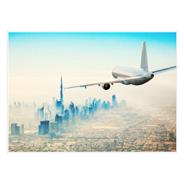 Samolot latający nad nowoczesnym miastem w jasnych barwach