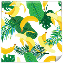 Obrane banany na tle liści palmowych
