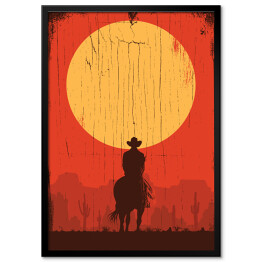 Cowboy jadący na koniu w stronę słońca