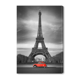 Wieża Eiffla i czerwony samochód w Paryżu