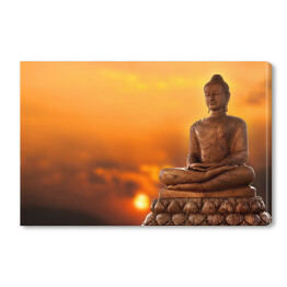 Obraz na płótnie Budda na tle zachodu słońca