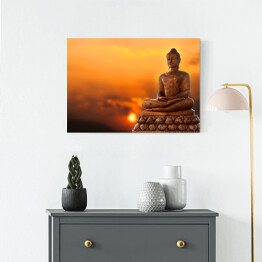 Obraz na płótnie Budda na tle zachodu słońca