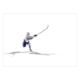 Profesjonalny gracz w hokeja trzymający kija w powietrzu