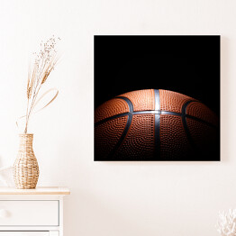 Obraz na płótnie Miejscowo oświetlona piłka do koszykówki