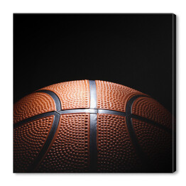 Obraz na płótnie Miejscowo oświetlona piłka do koszykówki