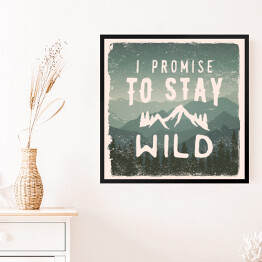 Obraz w ramie "Obiecuję, że pozostanę dziki" - cytat na tle gór