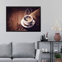Obraz w ramie Filiżanka i ziarna kawy na drewnianym tle