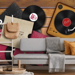 Fototapeta samoprzylepna Gramofon i rozrzucone płyty winylowe na drewnianym tle
