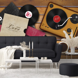 Fototapeta winylowa zmywalna Gramofon i rozrzucone płyty winylowe na drewnianym tle