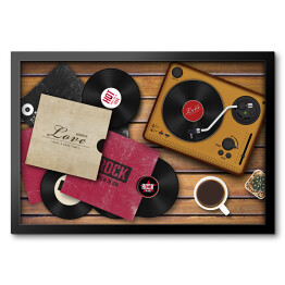 Obraz w ramie Gramofon i rozrzucone płyty winylowe na drewnianym tle