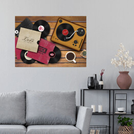 Plakat samoprzylepny Gramofon i rozrzucone płyty winylowe na drewnianym tle