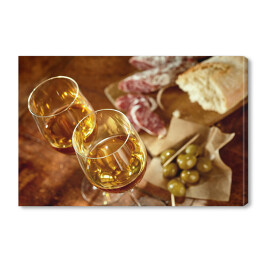 Obraz na płótnie Dwie szklanki sherry z hiszpańskimi tapas