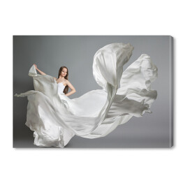 Obraz na płótnie Tańcząca młoda dziewczyna w białej sukni