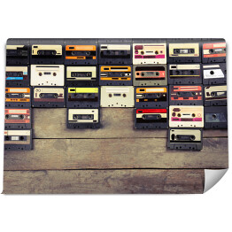 Fototapeta samoprzylepna Audio kasety na drewnianym stole