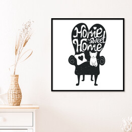 Plakat w ramie Nie ma to jak w domu - ilustracja z białym kota na czarnej kanapie