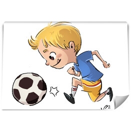 Chłopiec grający w piłkę nożną 