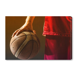 Obraz na płótnie Koszykarz w czerwonym stroju trzymający piłkę