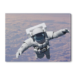 Obraz na płótnie Astronauta ponad chmurami