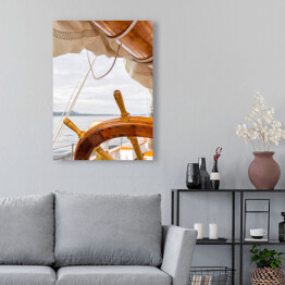 Obraz na płótnie Drewniany koło na dużej żaglówce przy morzem