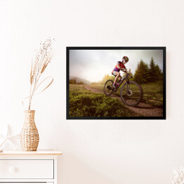 Obraz w ramie Jazda rowerem na tle lasu