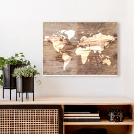 Obraz na płótnie Mapa świata na tle imitującym jasne drewno