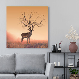 Obraz na płótnie Sylwetka jelenia z porożem imitującym koronę drzewa