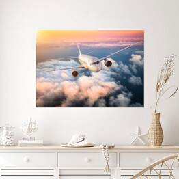Plakat samoprzylepny Samolot nad chmurami na kolorowym niebie