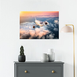 Plakat Samolot nad chmurami na kolorowym niebie