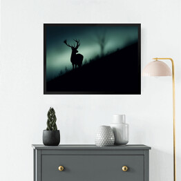 Obraz w ramie Sylwetka jelenia w lesie w odcieniach koloru szarego i niebieskiego
