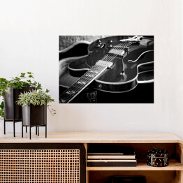 Plakat Gitara akustyczna z bliska na ciemnym tle