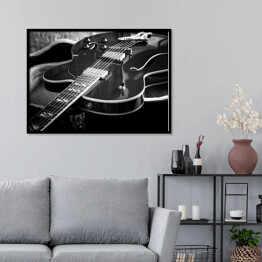 Plakat w ramie Gitara akustyczna z bliska na ciemnym tle