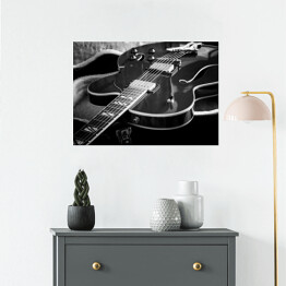 Plakat Gitara akustyczna z bliska na ciemnym tle