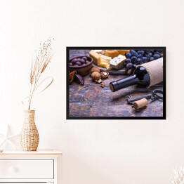 Obraz w ramie Czerwone wino w butelce oraz ser, oliwki, chleb, orzechy i figi na desce