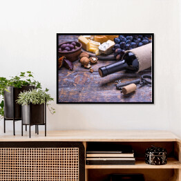Plakat w ramie Czerwone wino w butelce oraz ser, oliwki, chleb, orzechy i figi na desce