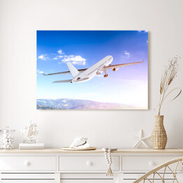 Obraz na płótnie Samolot lecący w blasku światła