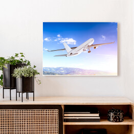 Obraz na płótnie Samolot lecący w blasku światła