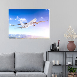 Plakat Samolot lecący w blasku światła