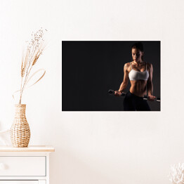 Plakat Kobieta napinająca mięśnie
