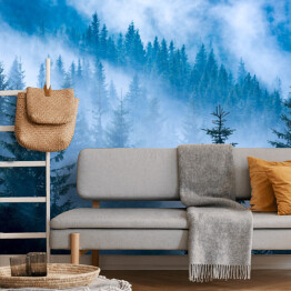 Fototapeta winylowa zmywalna Sosnowy las w niebieskiej mgle