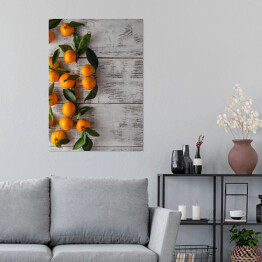 Plakat Gałązka mandarynek na drewnianym stole