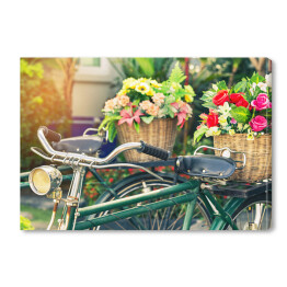 Obraz na płótnie Rower z bukietem kolorowych kwiatów w koszyku 