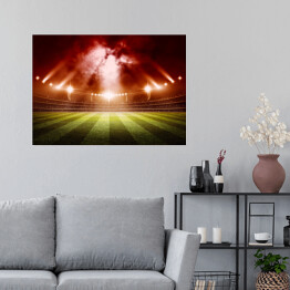Plakat samoprzylepny Stadion do gry w piłkę nożną oświetlony czerwonymi światłami