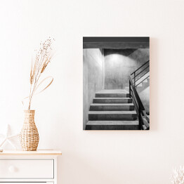 Obraz na płótnie Betonowe schody z czarną stalową poręczą