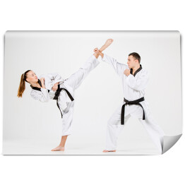 Fototapeta Dziewczyna i chłopiec ćwiczący karate