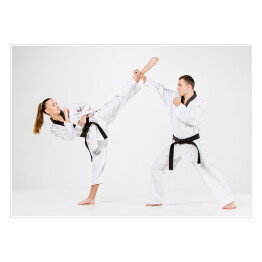 Plakat Dziewczyna i chłopiec ćwiczący karate