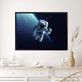 Obraz w ramie Astronauta w przestrzeni kosmicznej