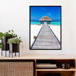 Plakat w ramie Drewniany domek na tropikalnej plaży w słoneczny dzień