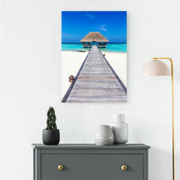 Obraz na płótnie Drewniany domek na tropikalnej plaży w słoneczny dzień