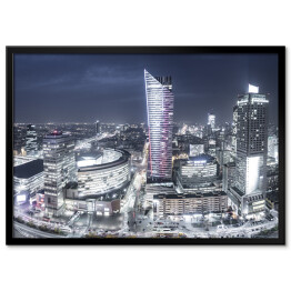 Plakat w ramie Warszawa - miasto z drapaczami chmur nocą