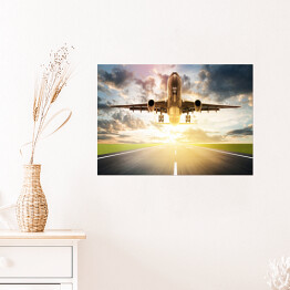 Plakat samoprzylepny Samolot wzbijający się w powietrze o wschodzie słońca